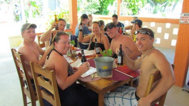 Lina and David Stock of Divergent Travelers with family in Caye Caulker Belize