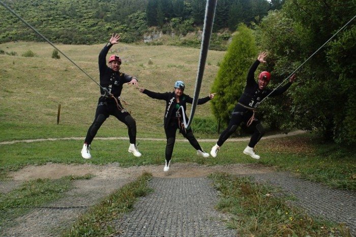 Learning how to use our abseiling harness... and imitating the Matrix. Waitomo