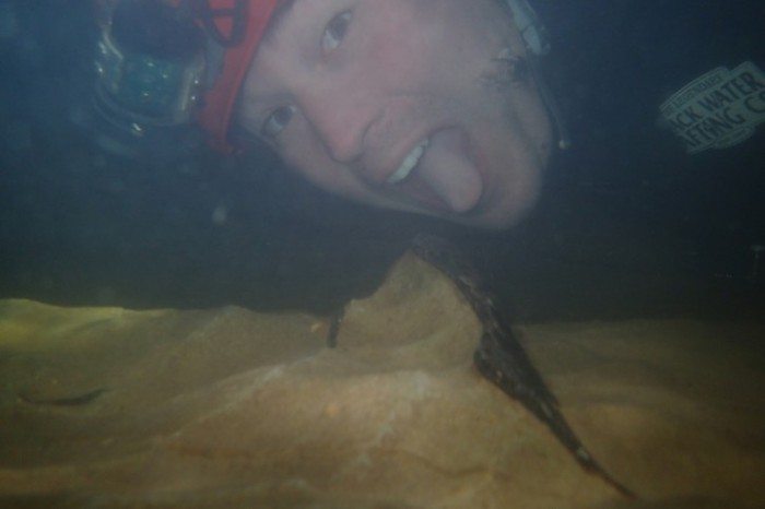 David licking a whale bone... underwater.. in a dark cave. Waitomo Glowworms