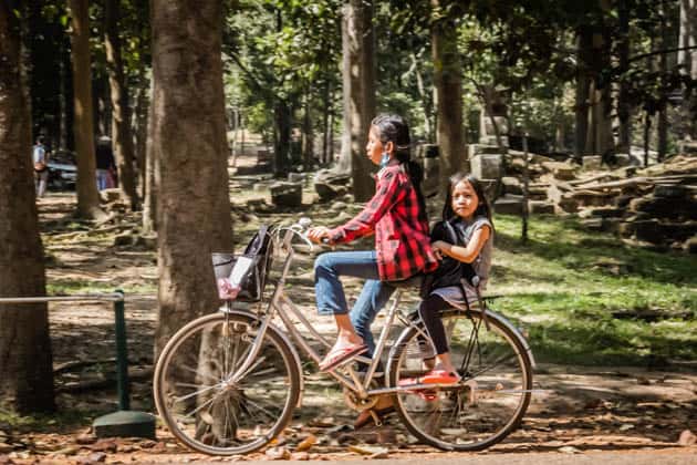Locals on bike Cambodia Photos