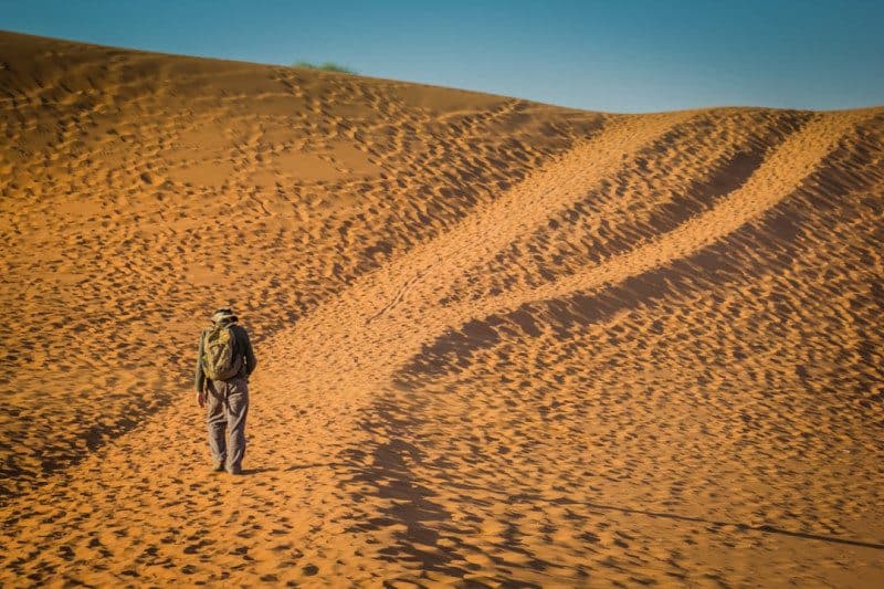 Man Walking to Deadvlei Namibia