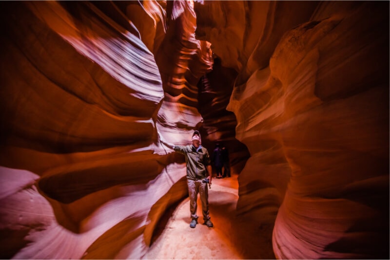 Man between the rock formation at Page, Arizona.