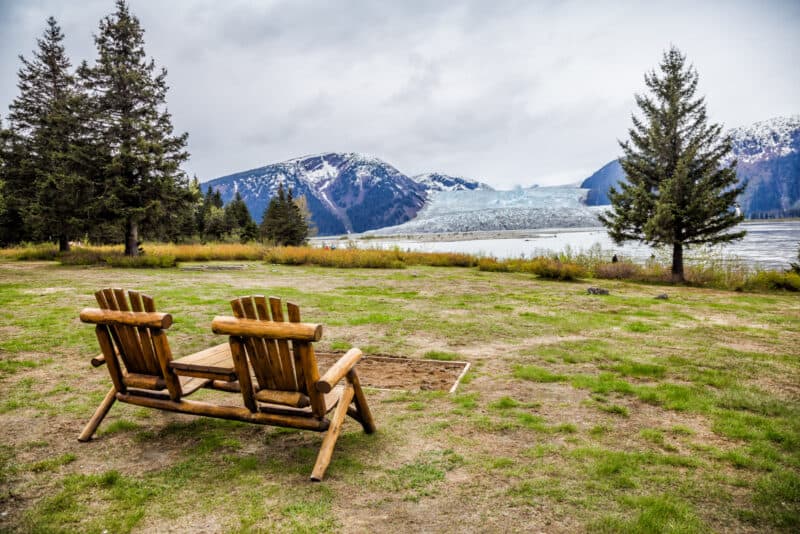 Two wooden bench and a landscape view in Alaska.